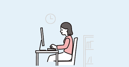 家でパソコンで仕事をしている女性