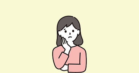 頬に手をつき悩む女性